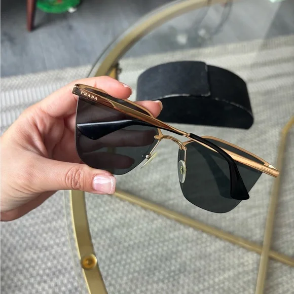 Prada Black Cat-Eye Glasses with Rimless Design display picture 3